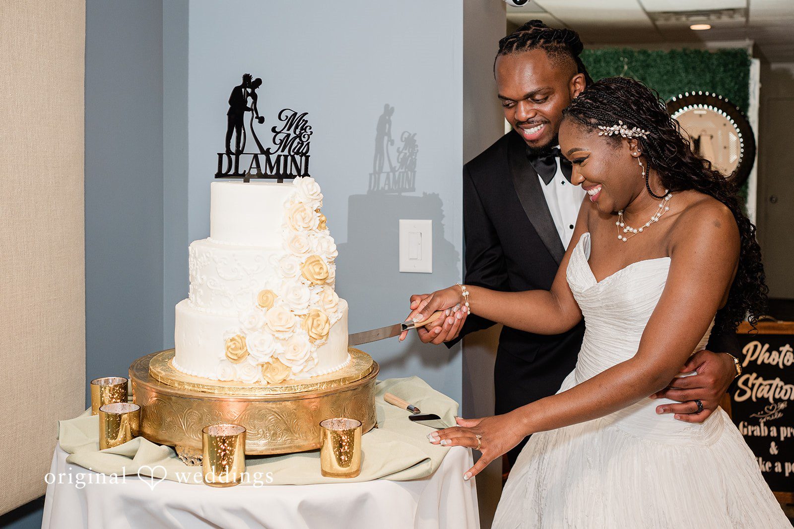 Khanyile + Shontel Bride and groom cutting their wedding cake together