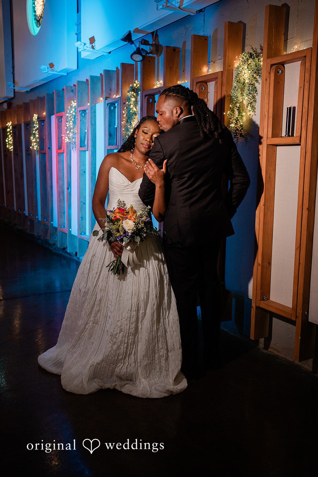 Khanyile + Shontel Bride and groom embracing during the celebration