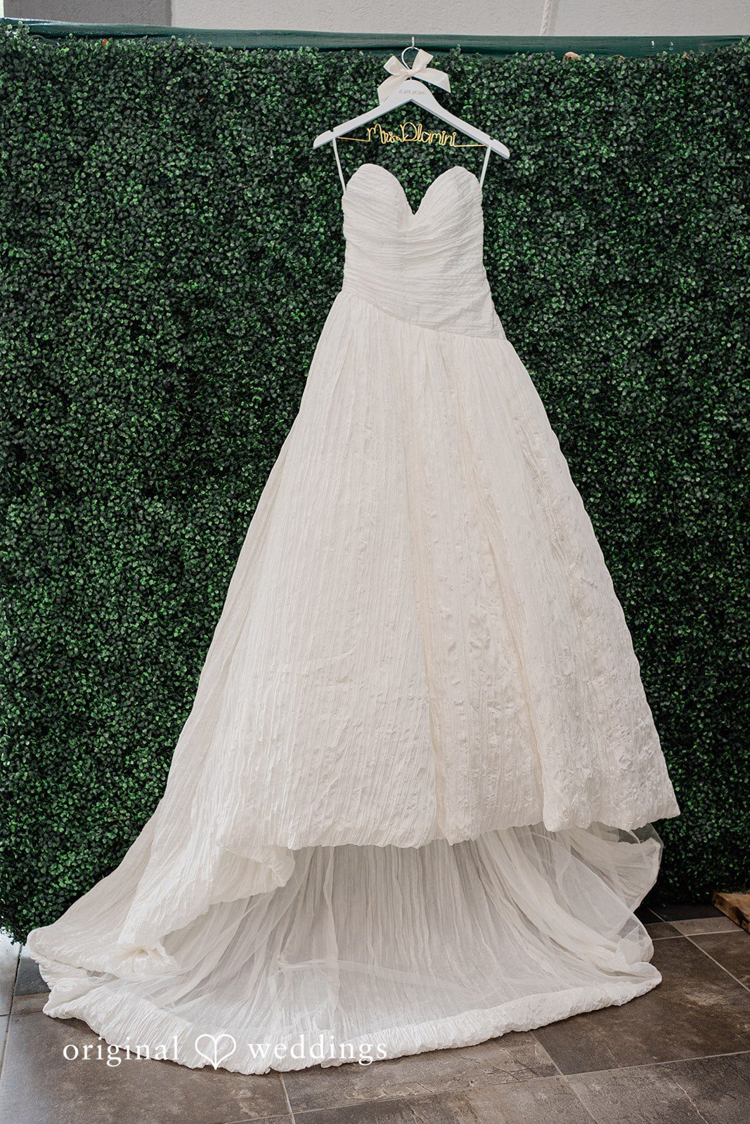 Khanyile + Shontel Wedding dress hanging before the ceremony