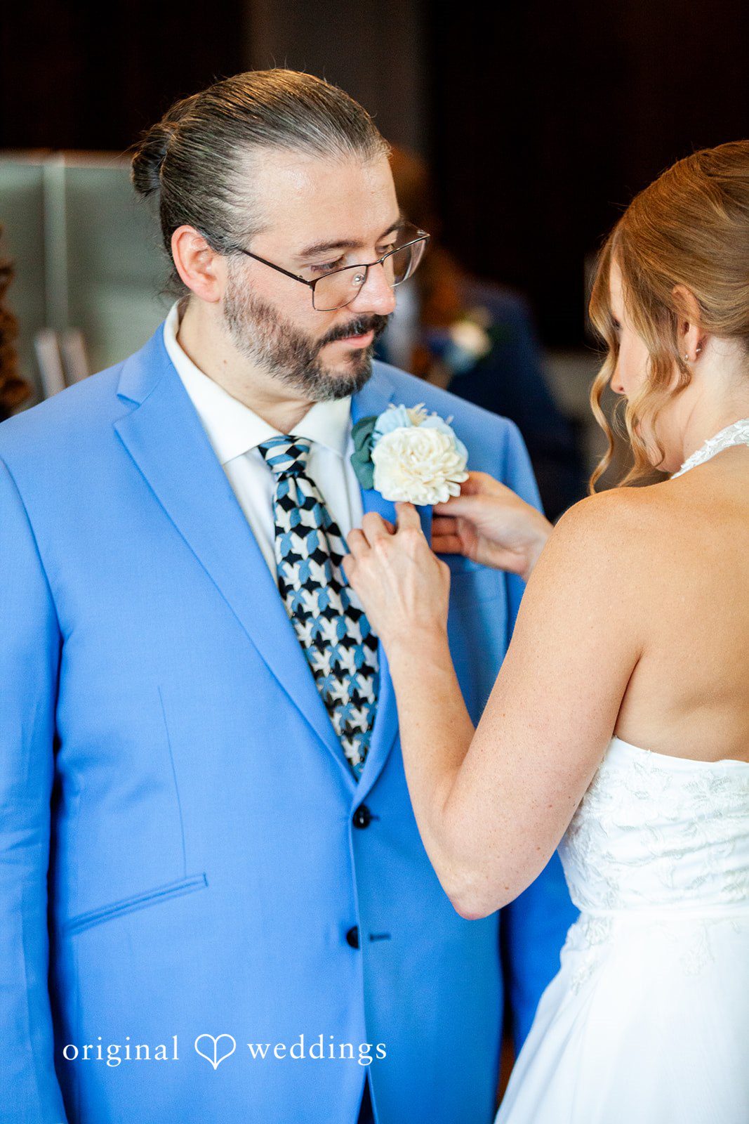 Sasha + Tom Bride helping groom get ready at The Great Hall at Green Lake