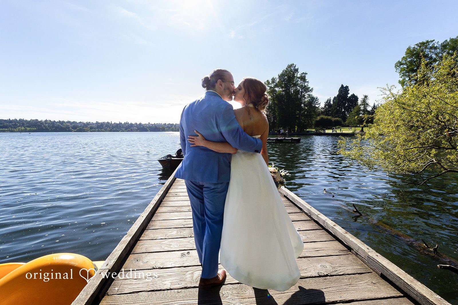 Sasha + Tom Bride and groom sharing a kiss at The Great Hall at Green Lake