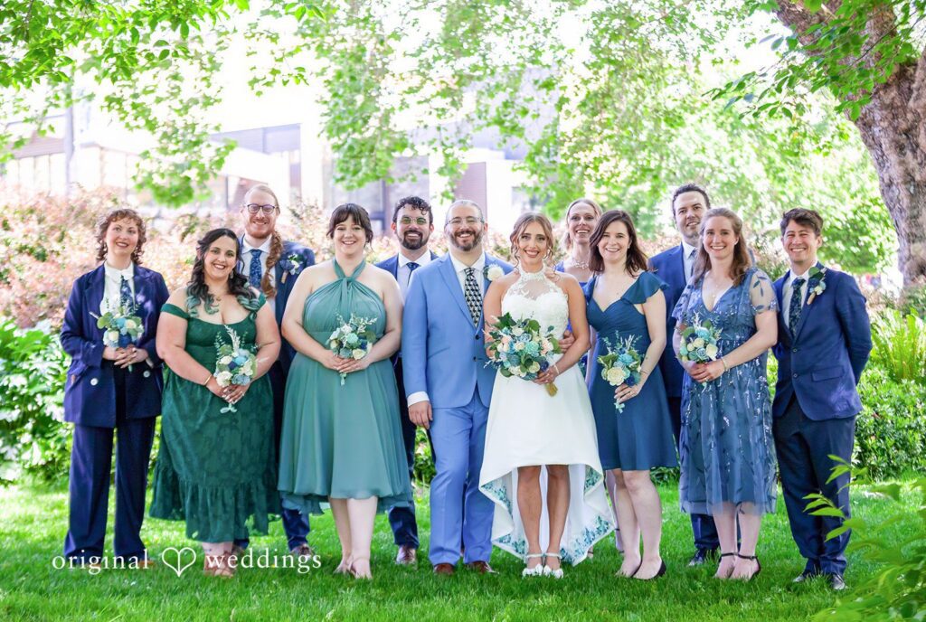 Sasha + Tom Seattle Wedding Photographers capturing couple with friends at The Great Hall at Green Lake by Original Weddings