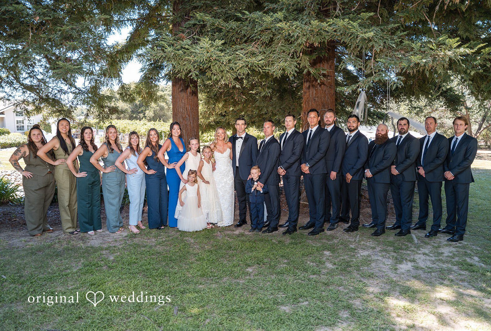 Stunning Portrait of couple with family by Sacramento Wedding Photographers from Original Weddings.