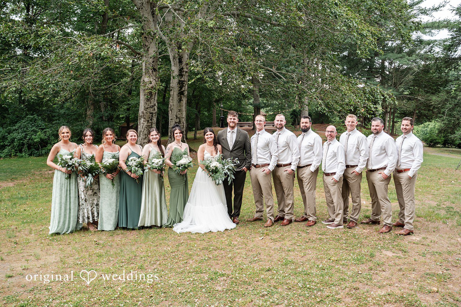 Bride and groom celebrating with bridesmaids and groomsmen after the ceremony