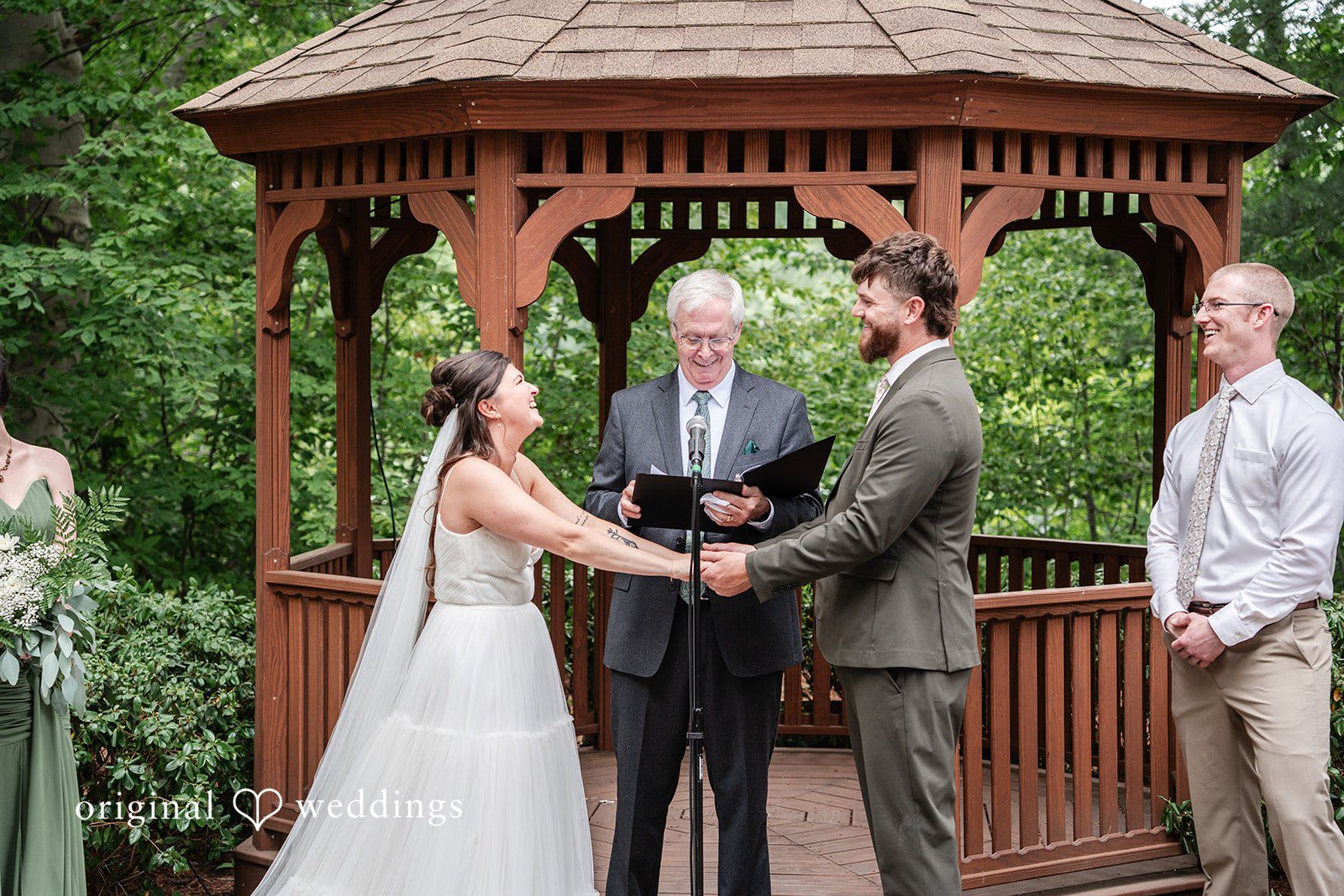 Bride and groom smiling lovingly at one another during their wedding day at The Pavilion on Crystal Lake captured by Hartford CT Wedding Photographers from Original Weddings.