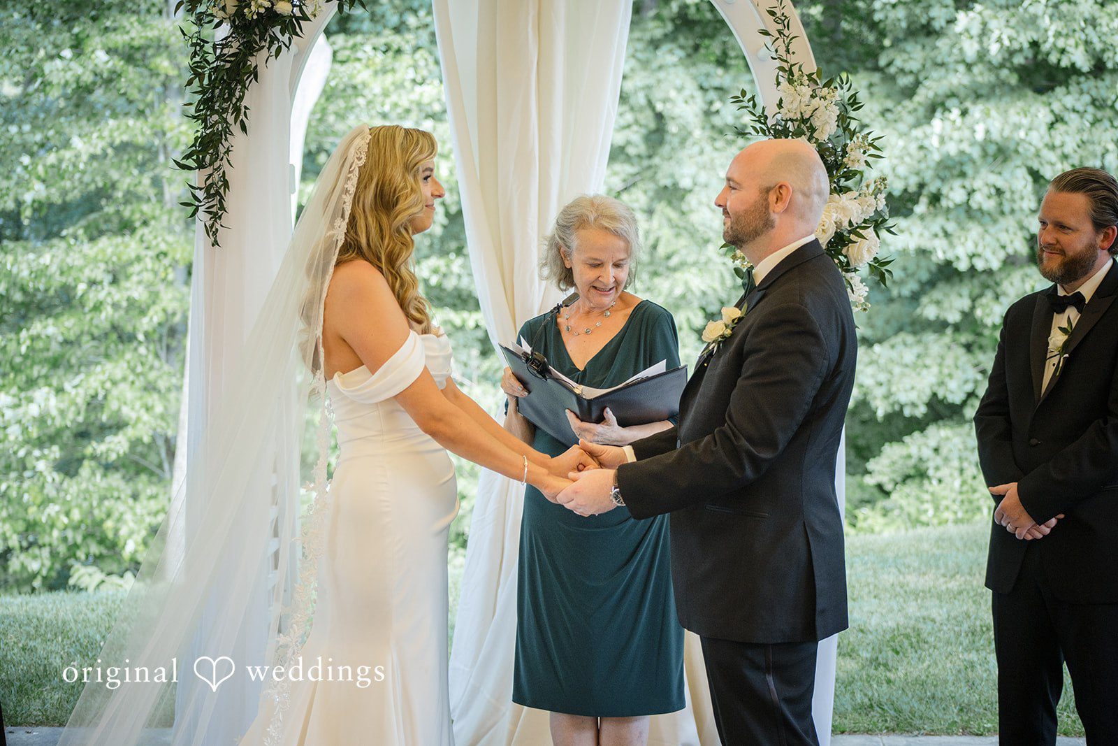 Kimberly + Jordan Wedding couple sharing a loving moment holding hands at The Riverview captured by Hartford CT Wedding Photographers from Original Weddings