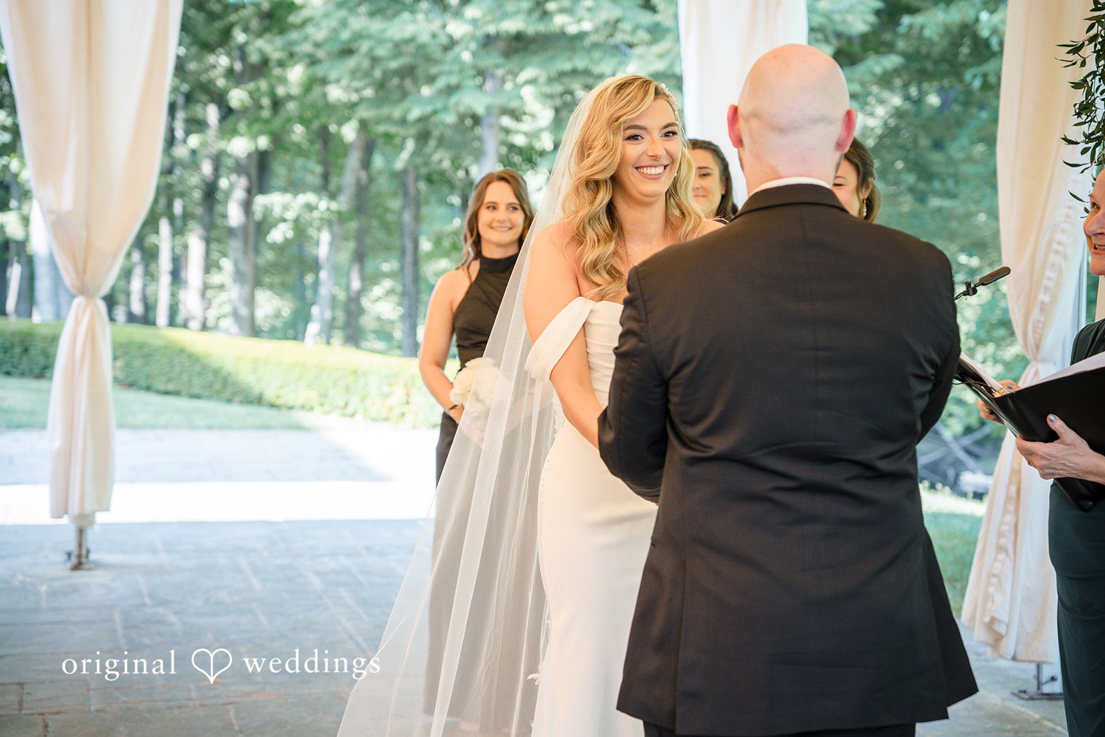 Kimberly + Jordan Bride smiling during ceremony