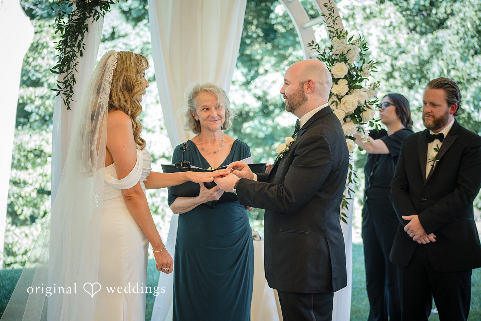 Kimberly + Jordan Romantic eye-contact pose and rin exchange moments at The Riverview captured by Hartford CT Wedding Photographers from Original Weddings