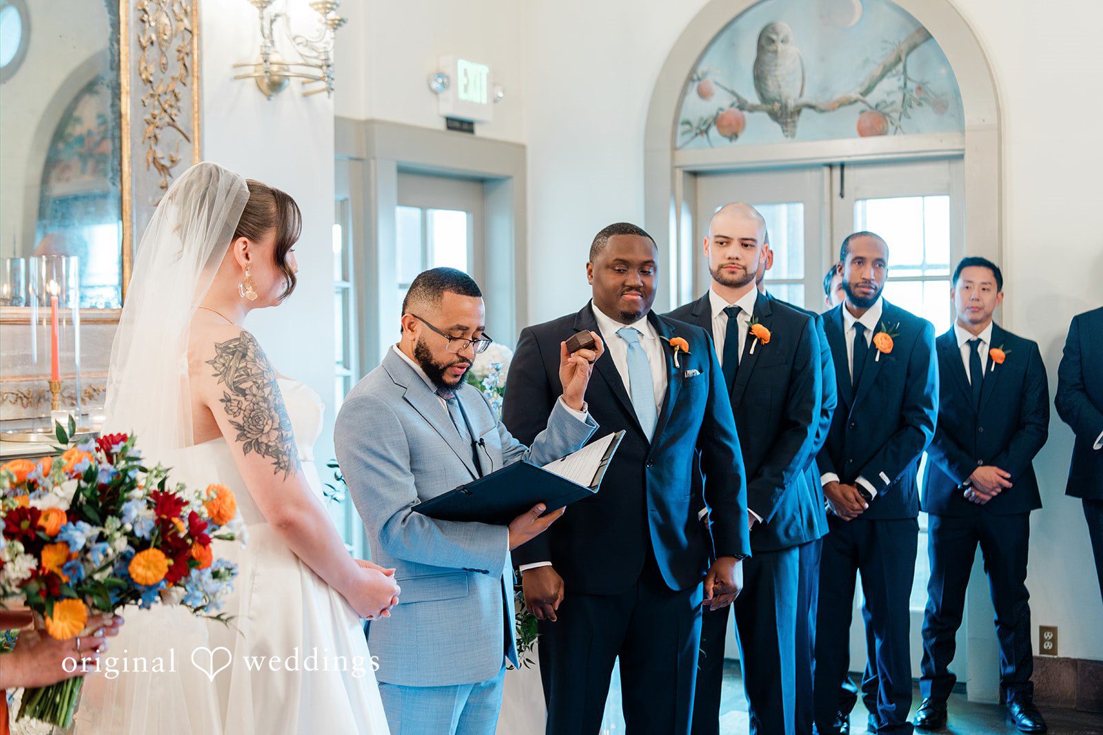 Madison + Malik A ceremony taking place with the wedding party standing at the altar.