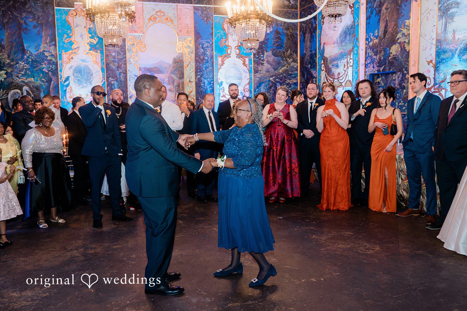 Madison + Malik Guests dancing together on a crowded dance floor during a reception.