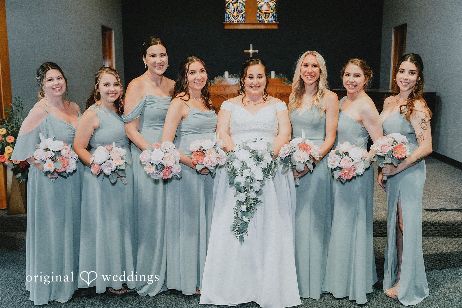 Kevin + Brooke Group picture of bride with bridesmaids, all smiling and holding bouquets