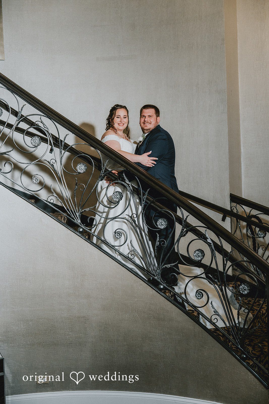 Kevin + Brooke Stunning portrait of couple standing at the stairs at The Seville