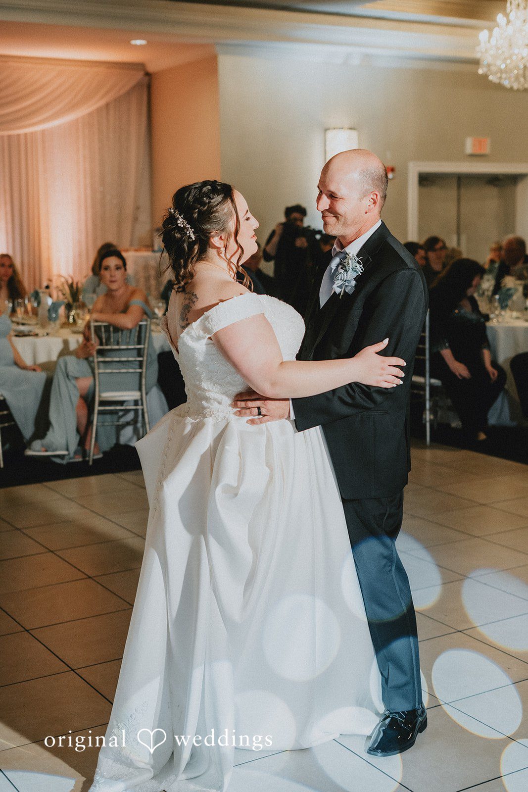 Kevin + Brooke Bride sharing a dance with someone at The Seville