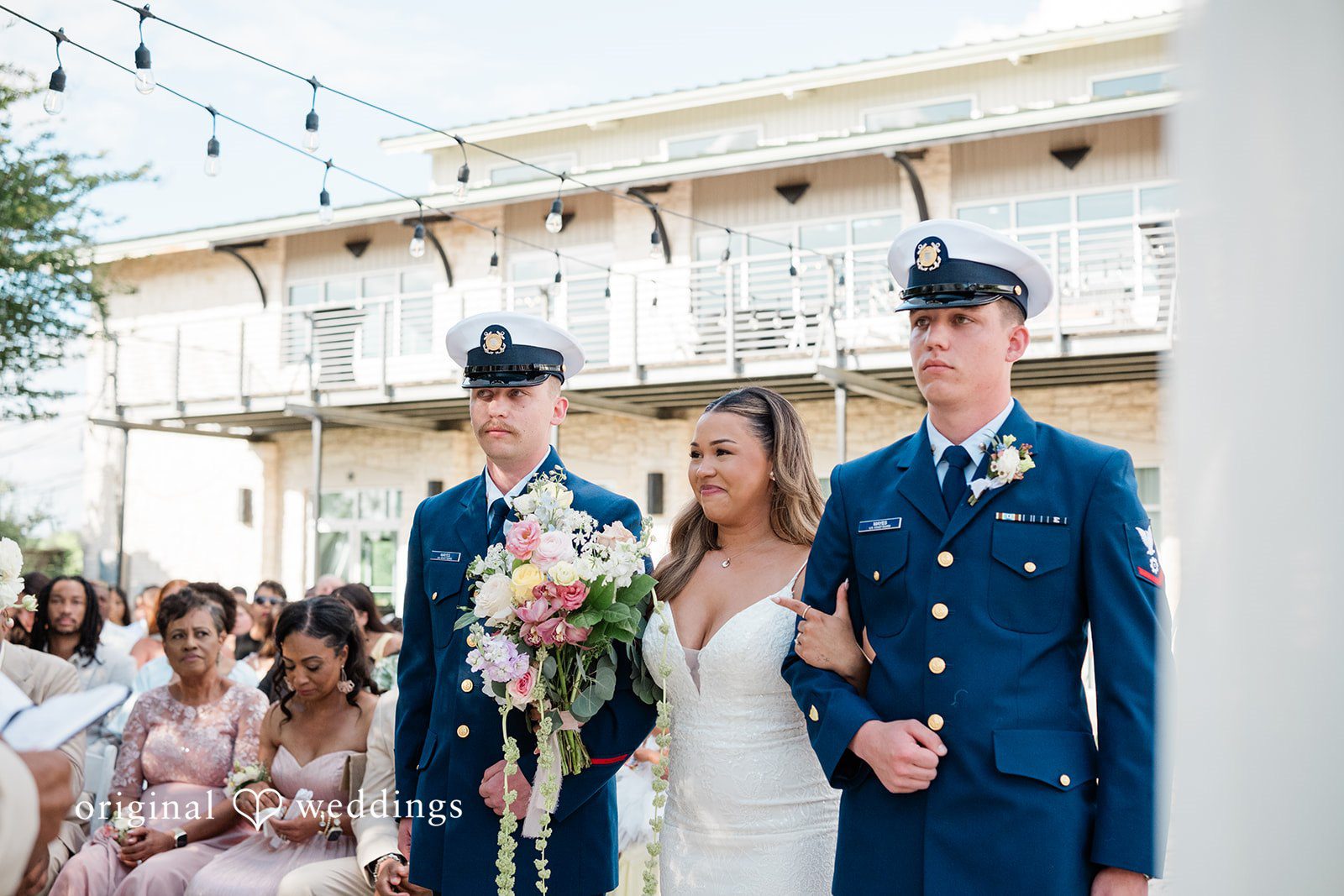 Lilly + Cade Bride walking down the aisle during the ceremony at The Terrace Club.