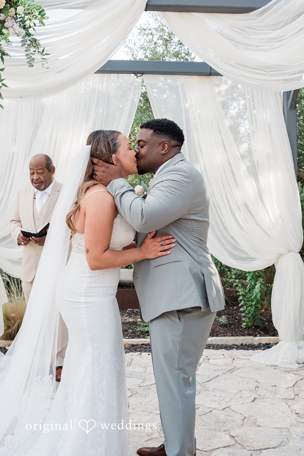 Lilly + Cade Couple sharing a romantic kiss at The Terrace Club captured by Austin Wedding Photographers from Original Weddings.