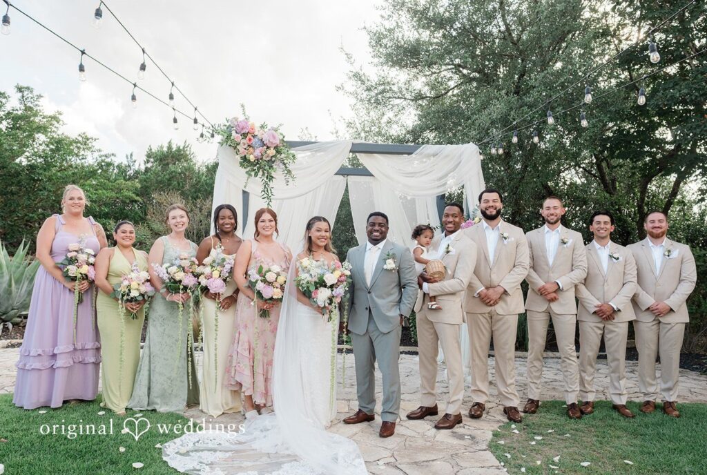 Lilly + Cade Bride and groom with bridesmaids and groomsmen at The Terrace Club captured by Austin Wedding Photographers from Original Weddings.
