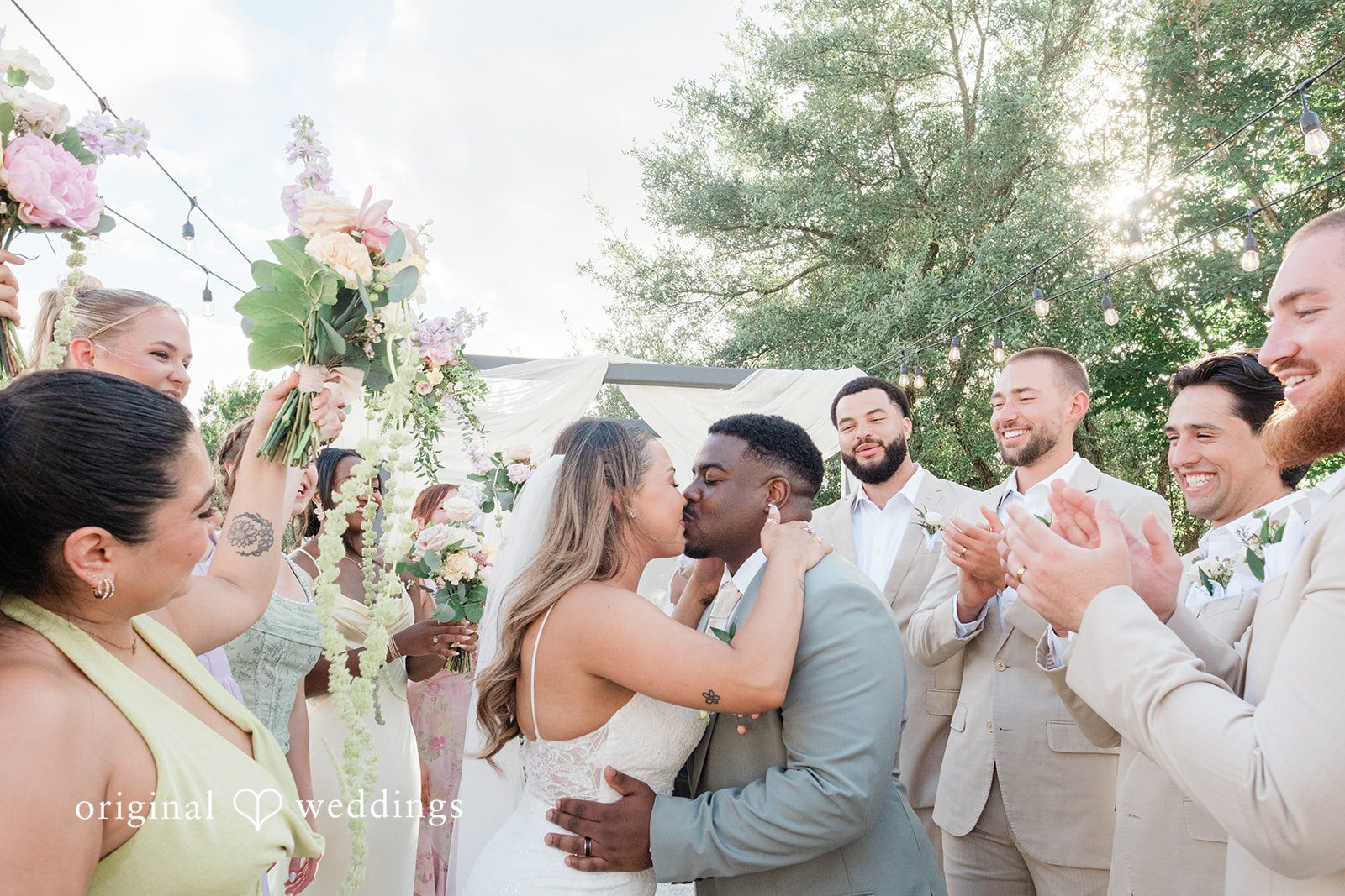 Lilly + Cade Newlyweds celebrating with a kiss at The Terrace Club.