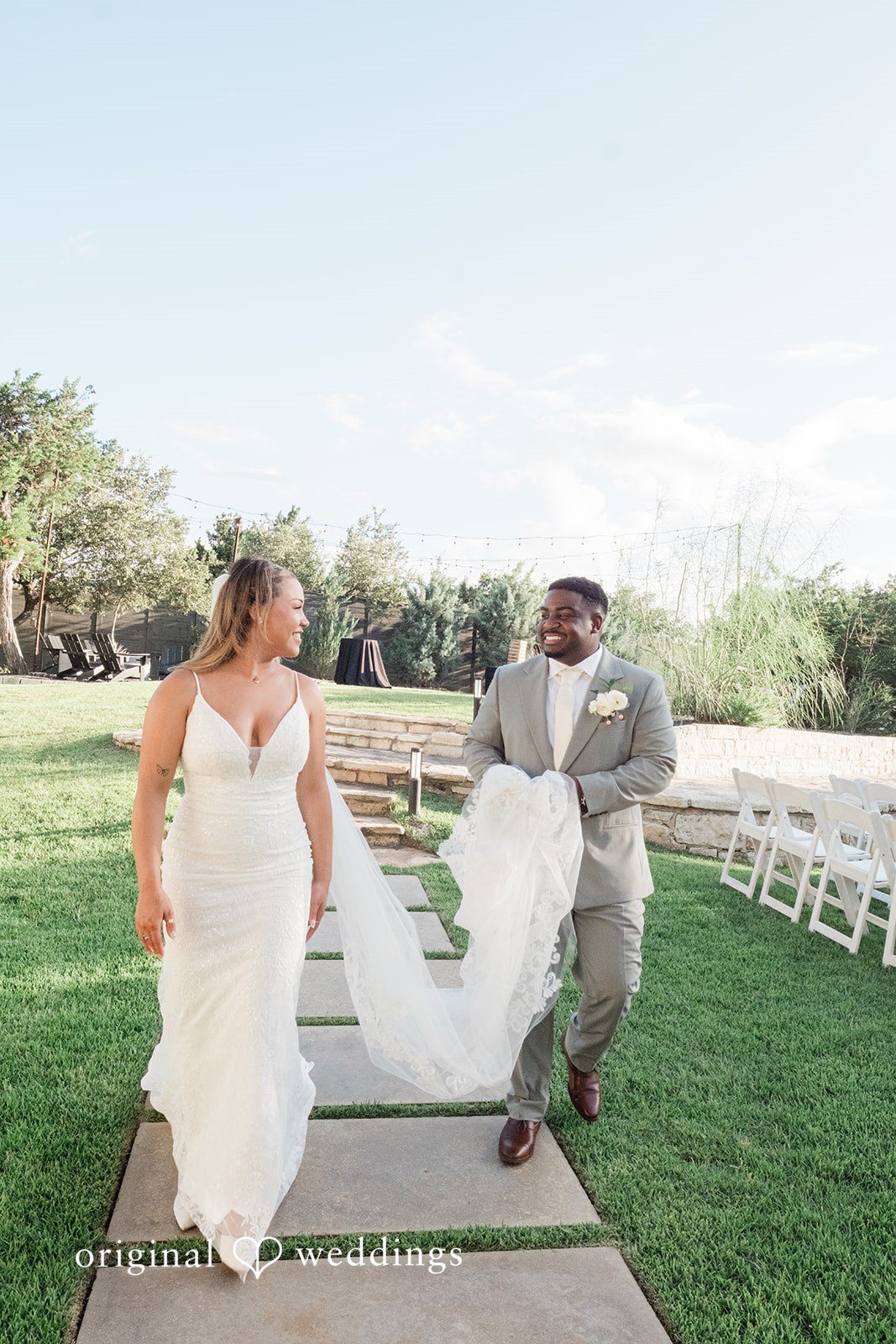 Lilly + Cade Elegant newlywed portrait featuring the bride's flowing veil at The Terrace Club.