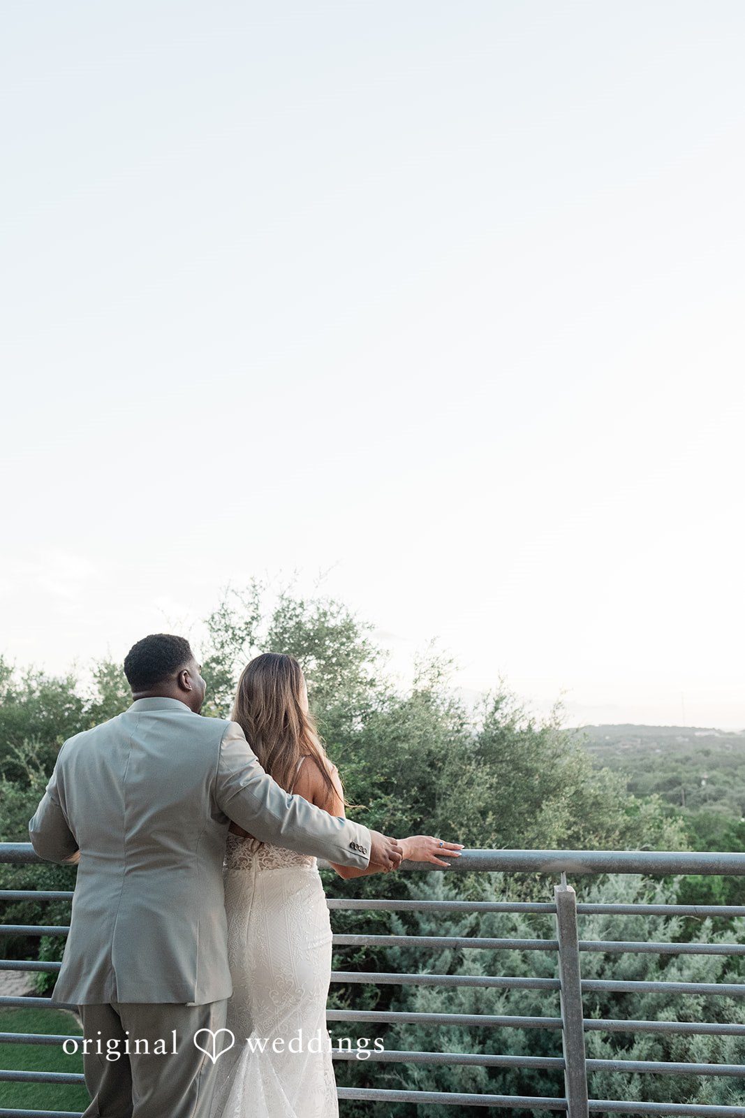 Lilly + Cade Bride and groom overlooking the scenic landscape at The Terrace Club captured by Austin Wedding Photographers from Original Weddings.