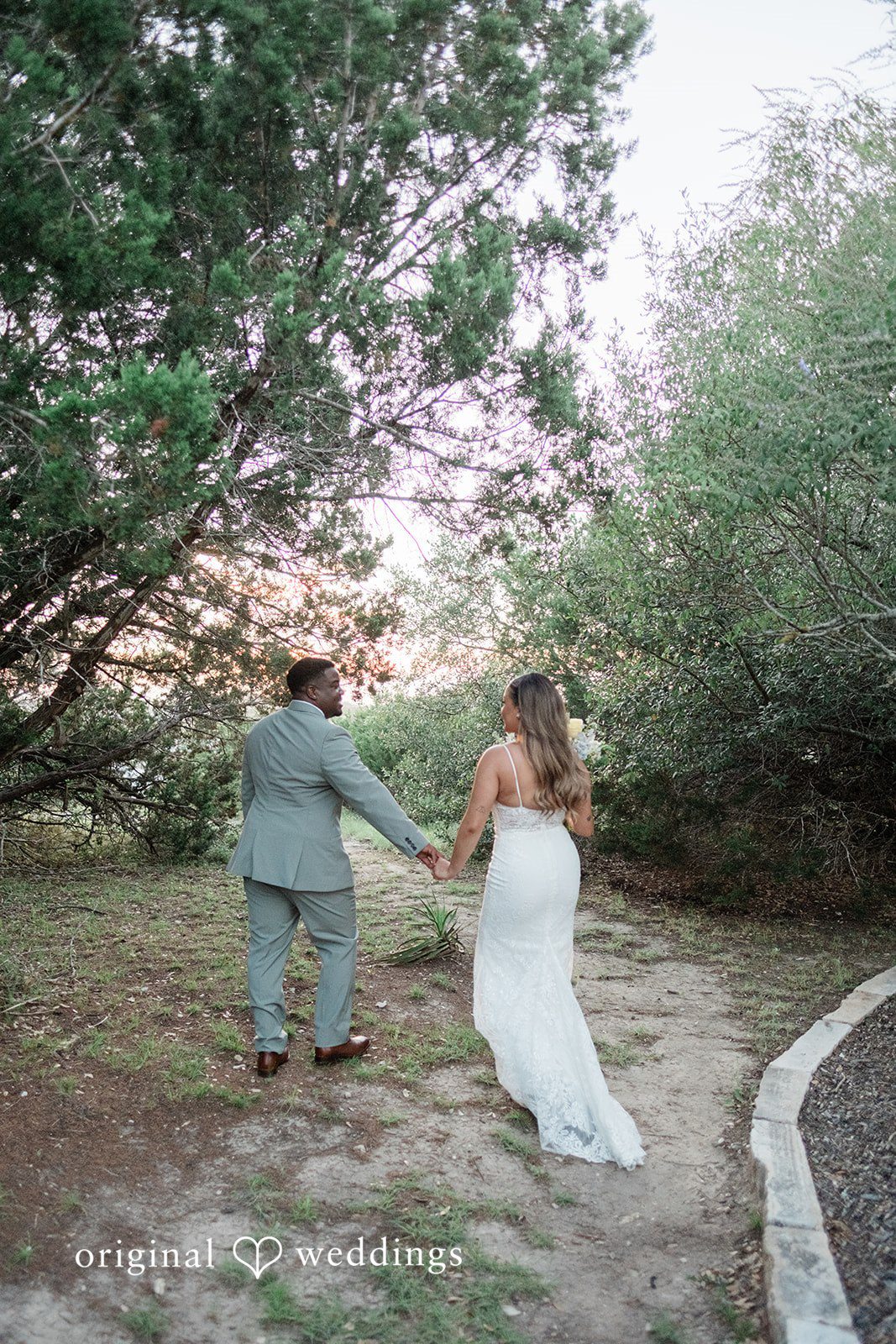 Lilly + Cade Bride and groom walking together after their wedding ceremony at The Terrace Club.