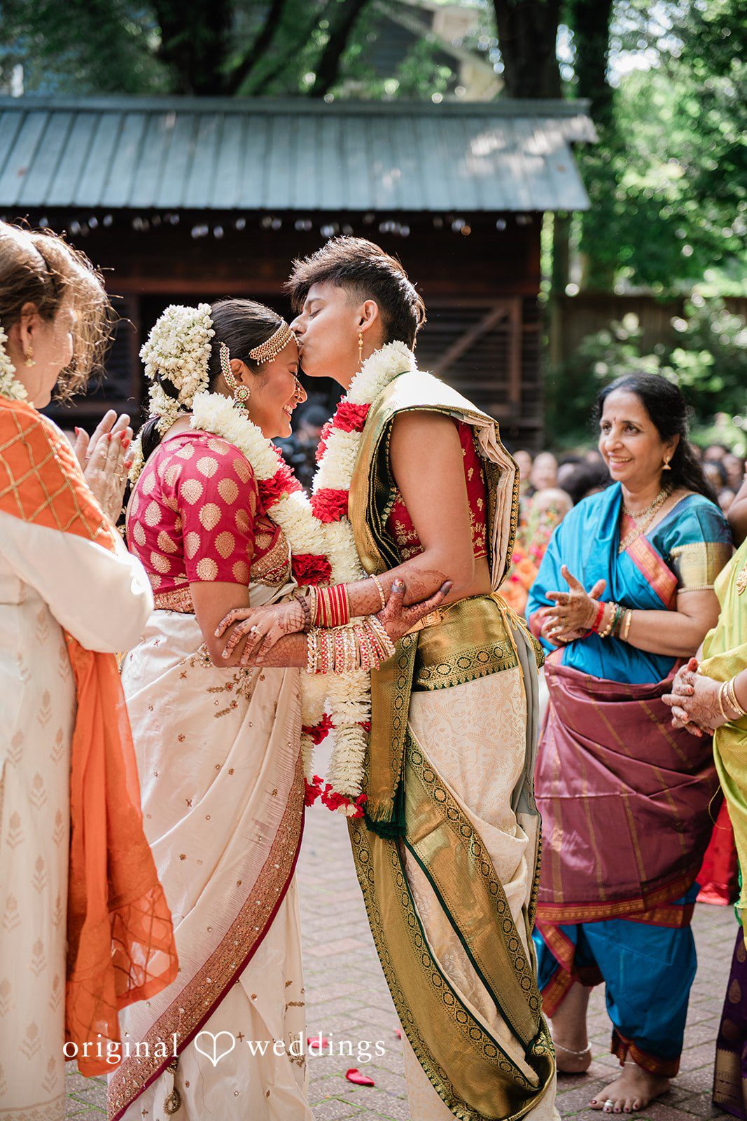 Sonya + Akshaya A bride and groom embracing at Trolley Barn.