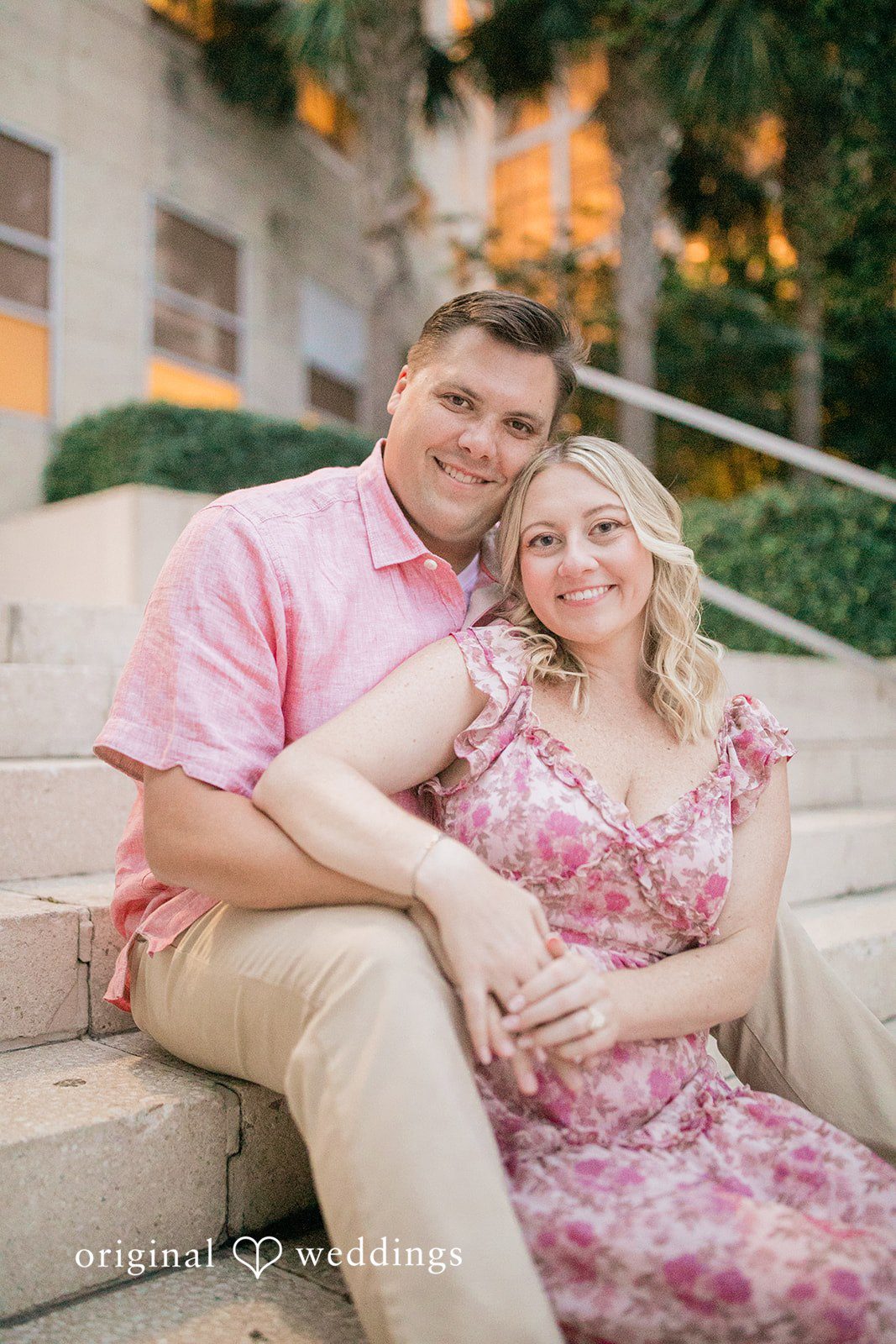 Taylor + Jack Couple sitting closely together on stone steps.
