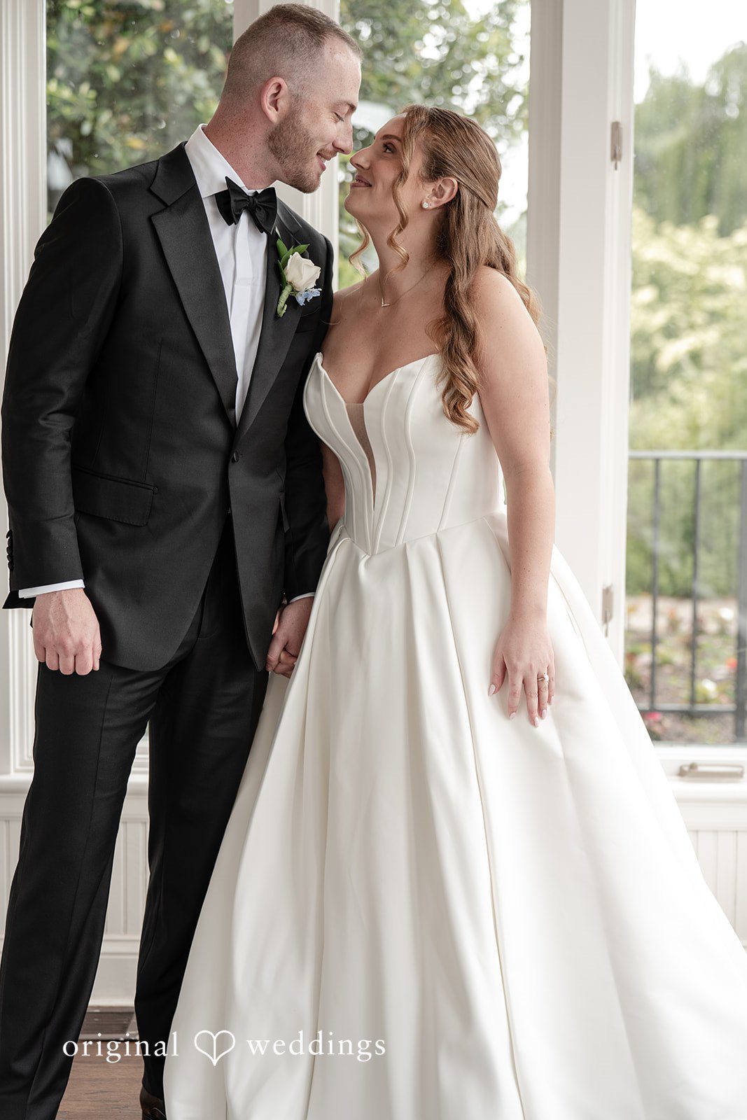 Christina + Christopher Bride and groom sharing a romantic first kiss