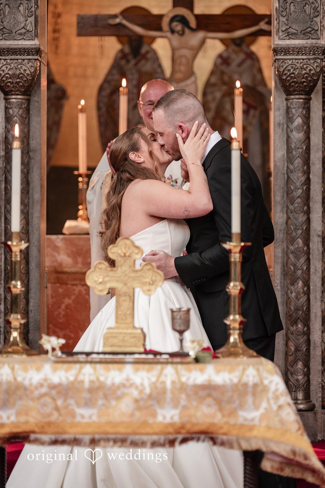 Christina + Christopher Bride and groom sharing their first kiss after the ceremony