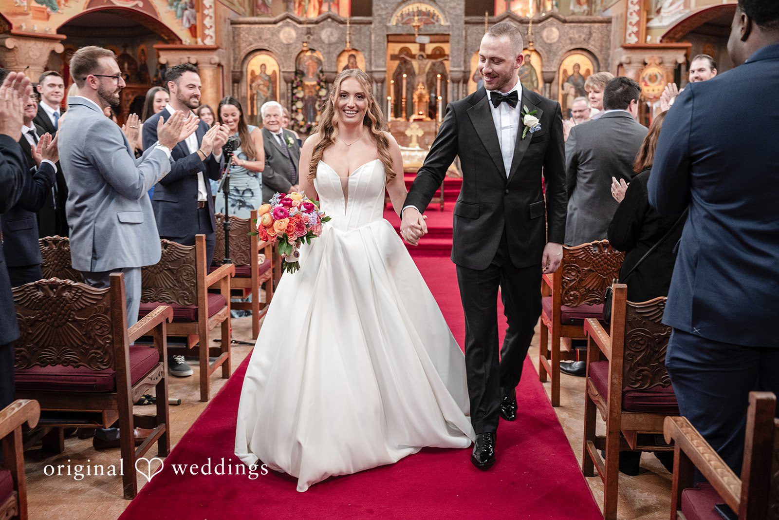 Christina + Christopher Newlyweds walking down the aisle together