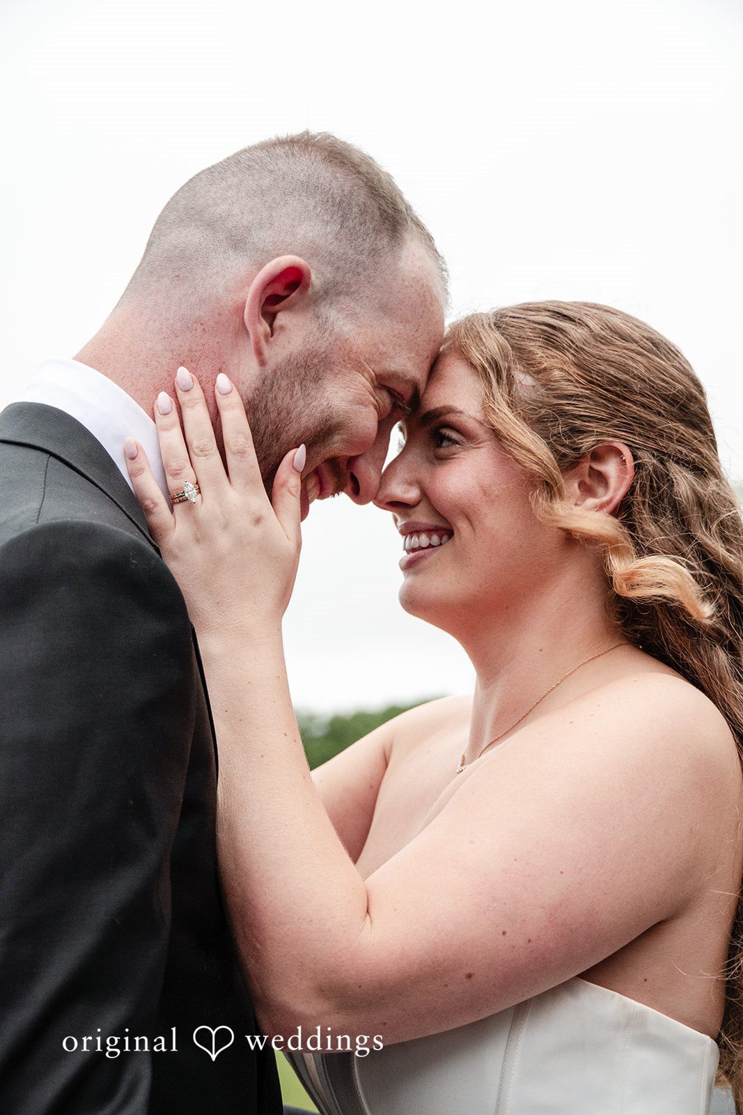 Christina + Christopher Close-up portrait of the couple embracing outdoors