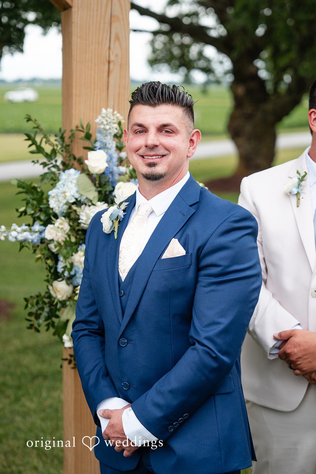 Groom smiling before the ceremony