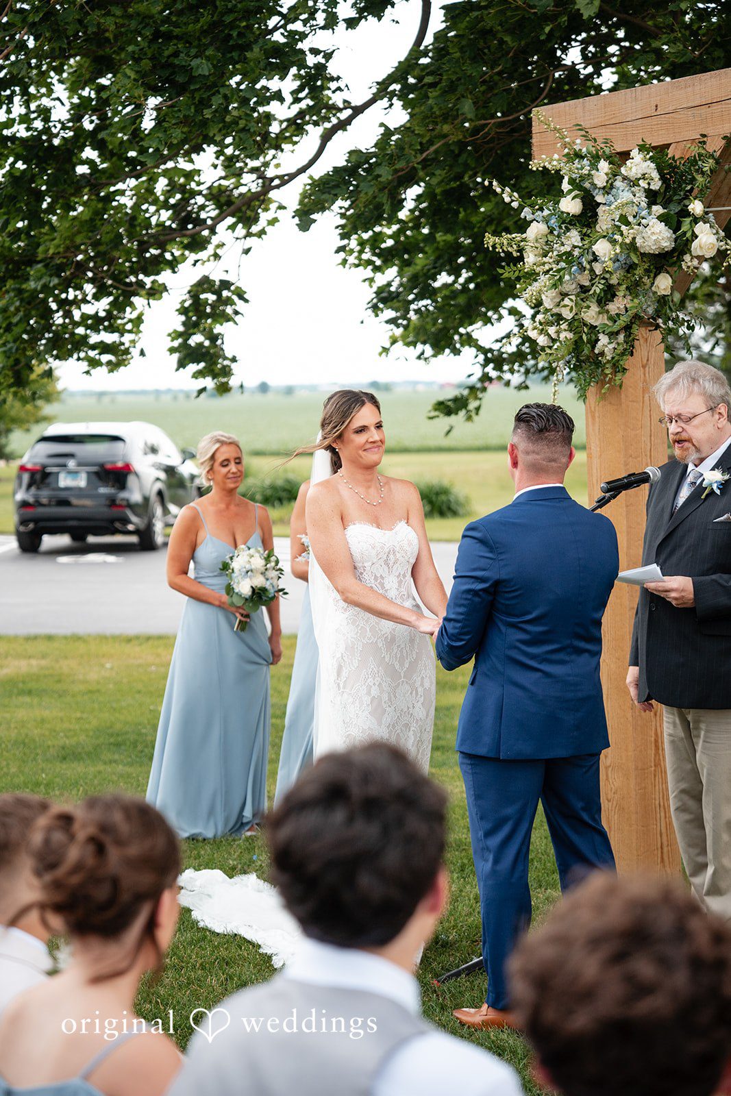 Beautiful outdoor wedding ceremony surrounded by lush countryside