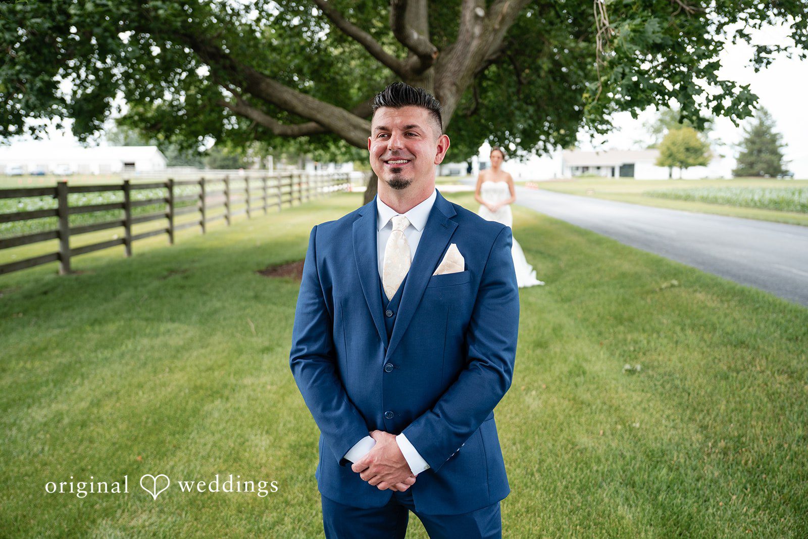 Groom smiling before seeing his bride during the wedding day