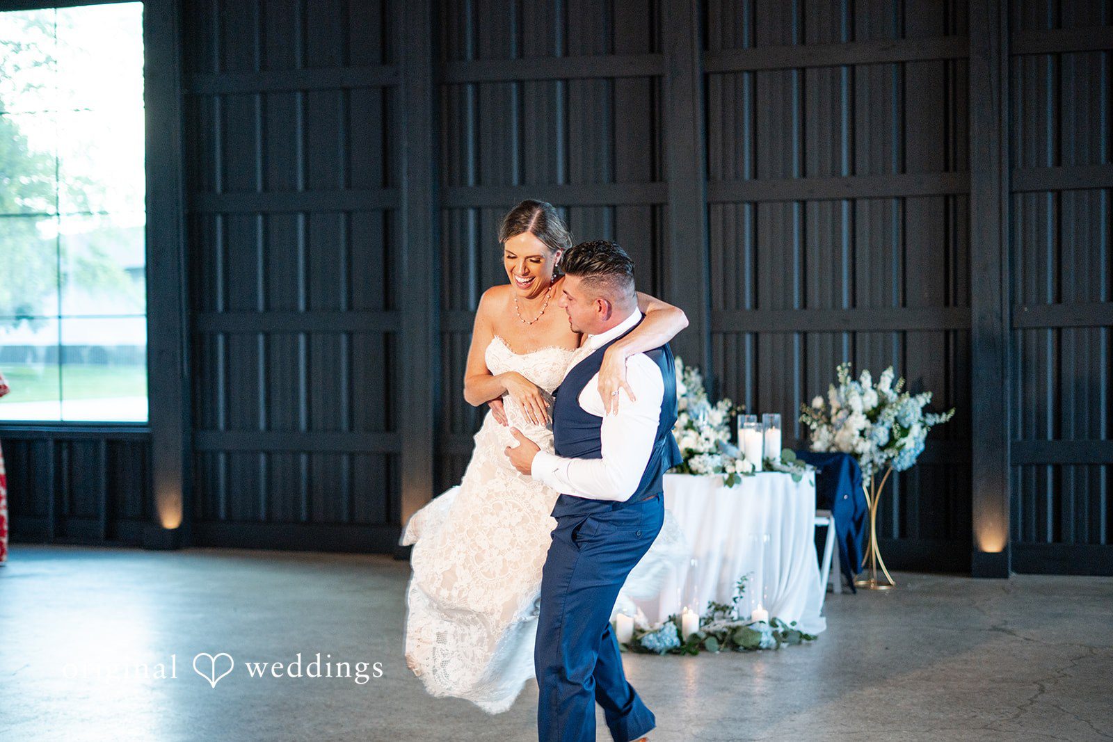 Groom lifting his bride during an exciting dance celebration