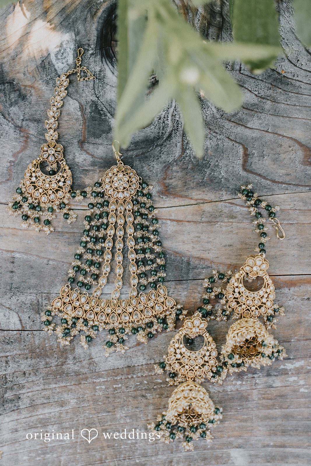 Close-up of traditional bridal jewelry featuring earrings and necklace at Willows Lodge
