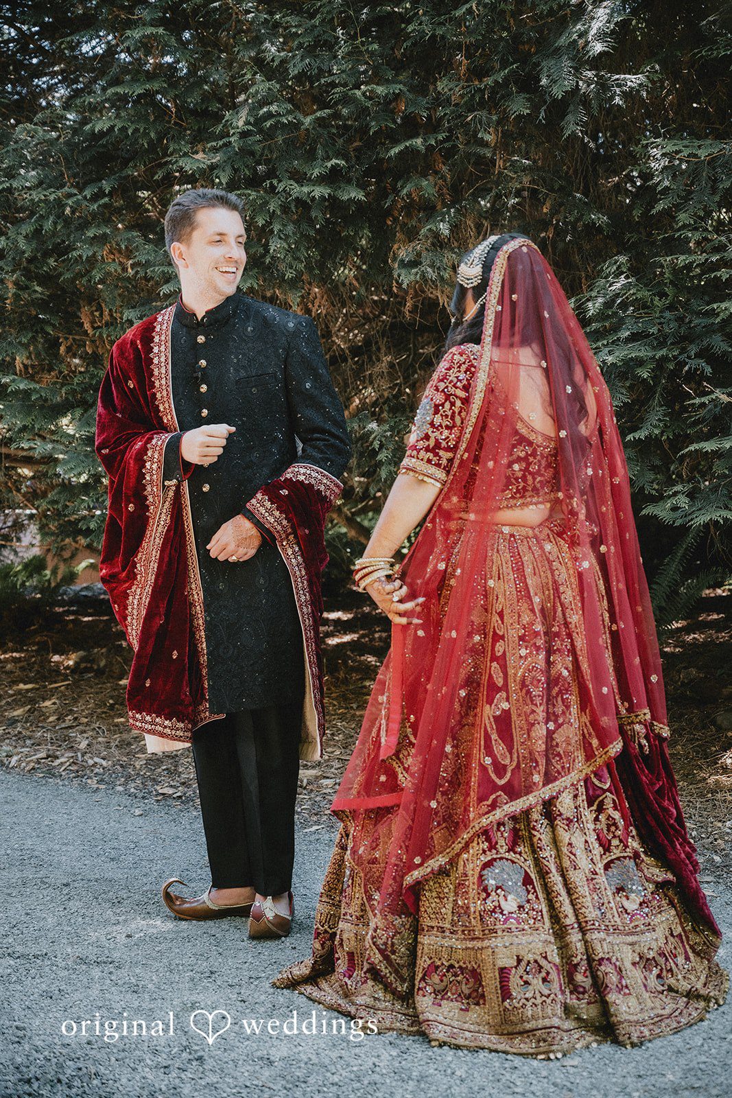 Bride gently approaching the groom and groom smiling
