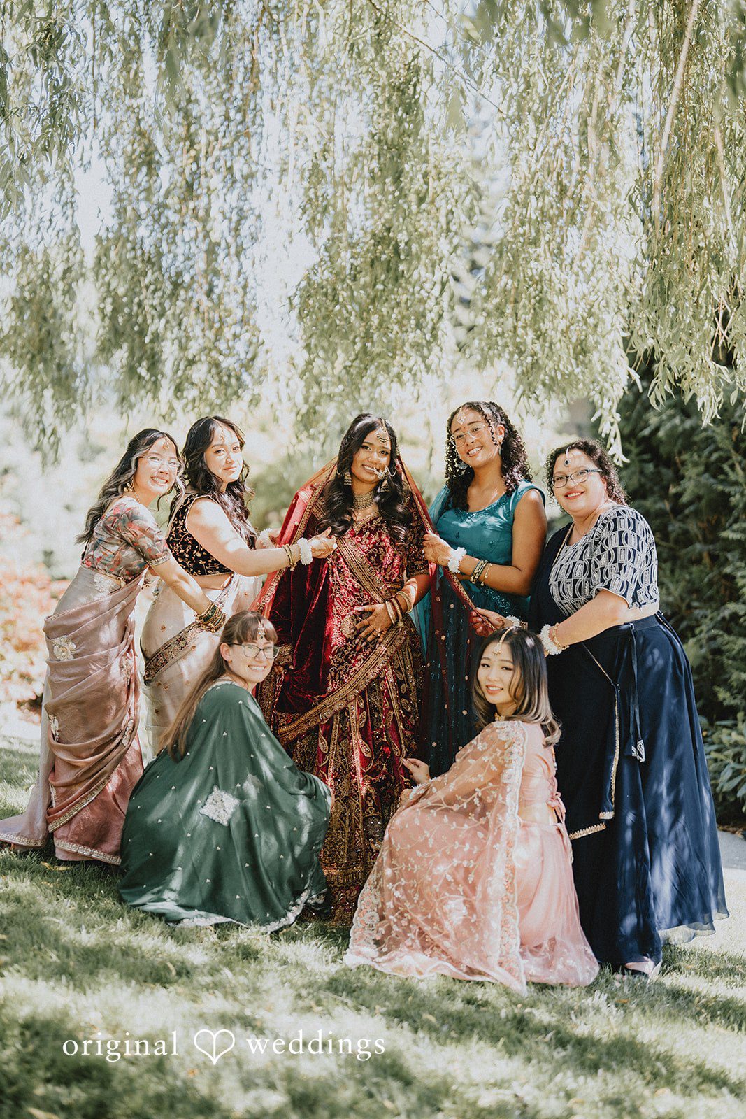 Bride sharing joyful moments with her bridesmaids before the ceremony