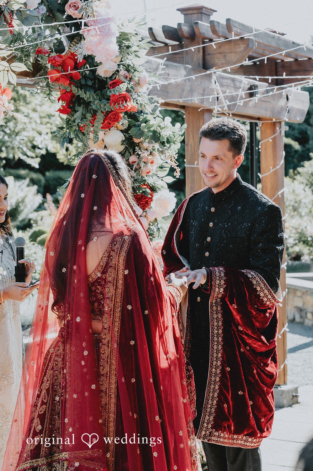 Groom smiling lovingly at the bride
