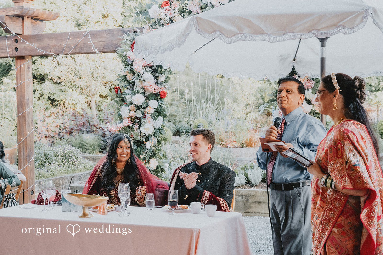Happy newlyweds enjoying their wedding reception at Willows Lodge