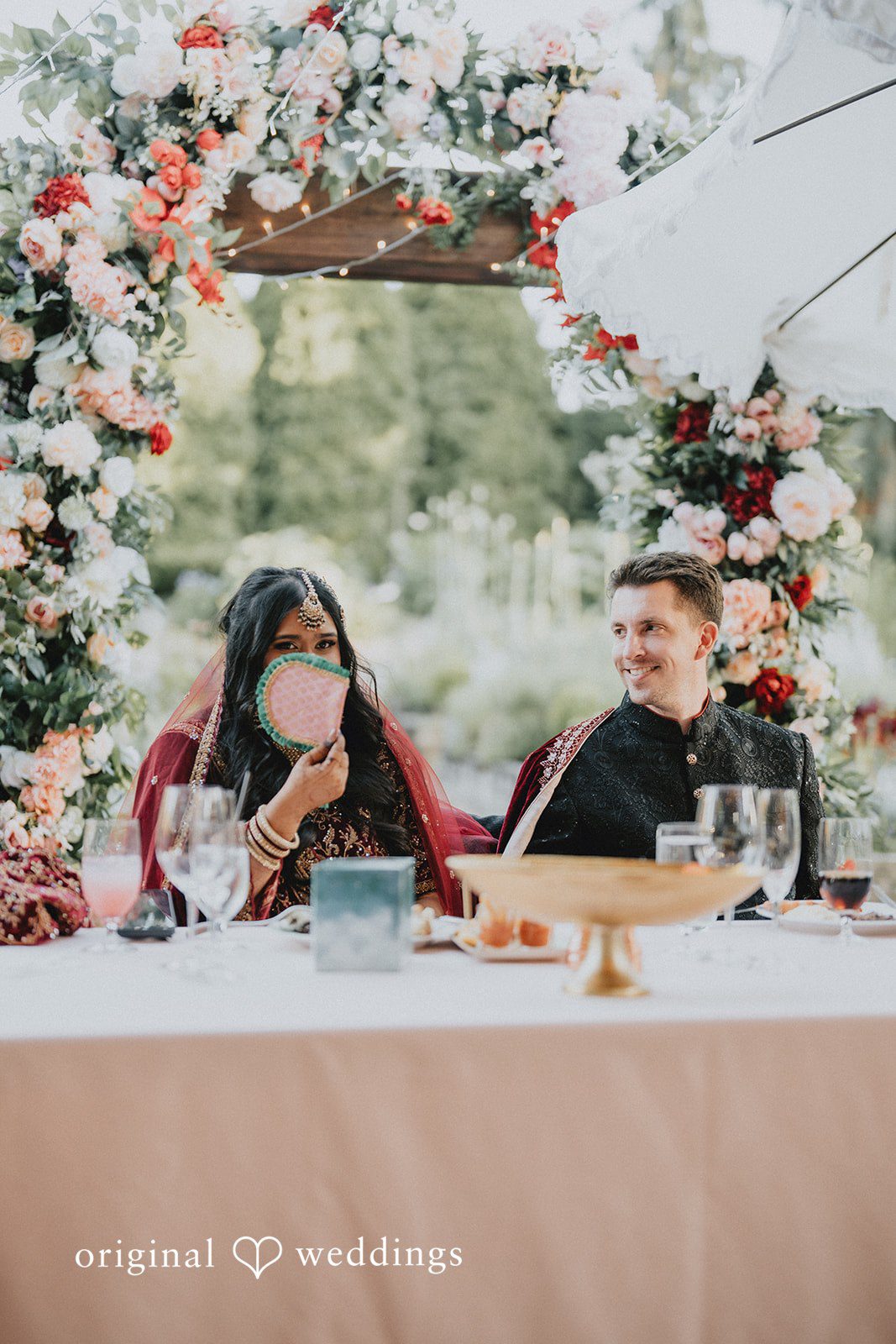 Happy newlyweds enjoying their wedding reception.