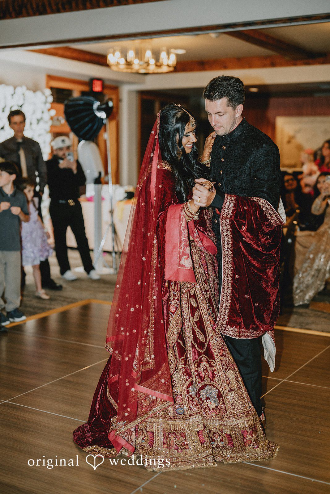 Bride and groom dancing together during the reception.