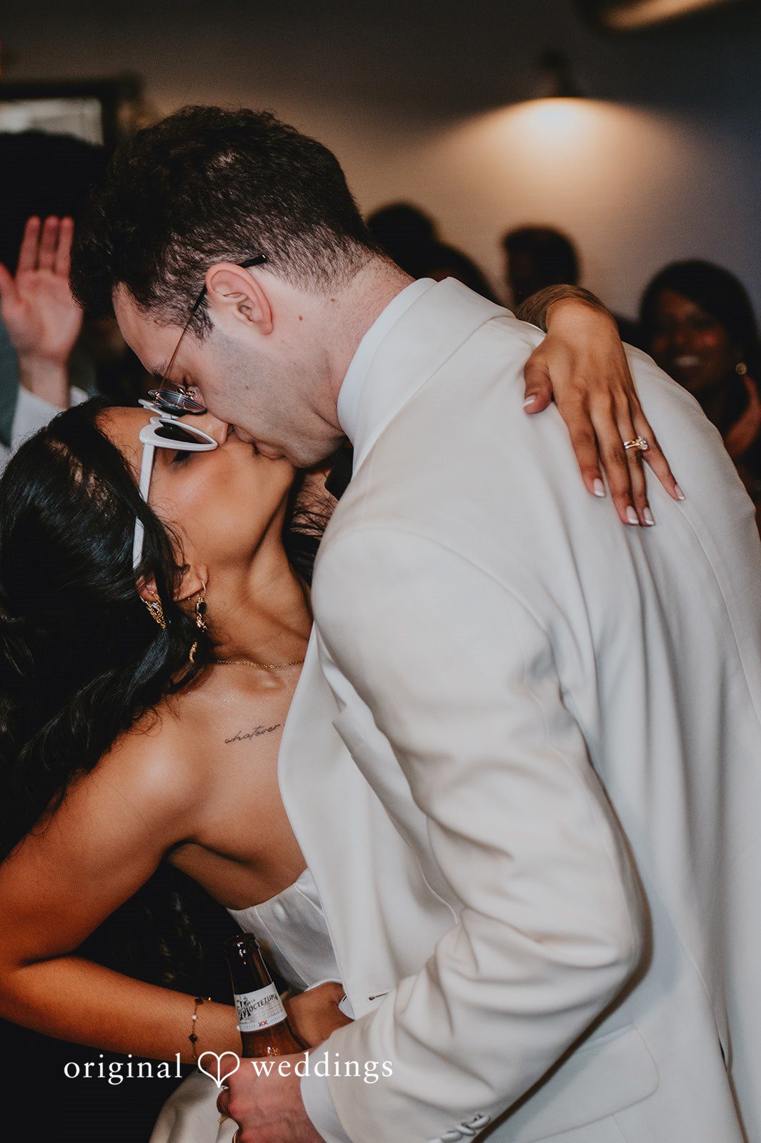 The couple shares a romantic kiss