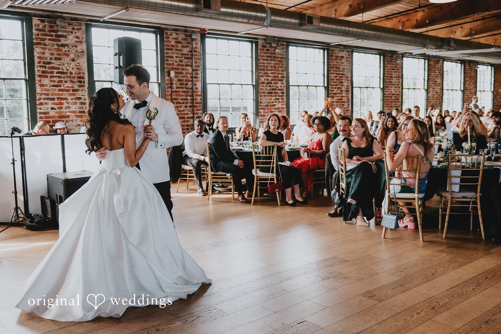 The couple takes their first dance