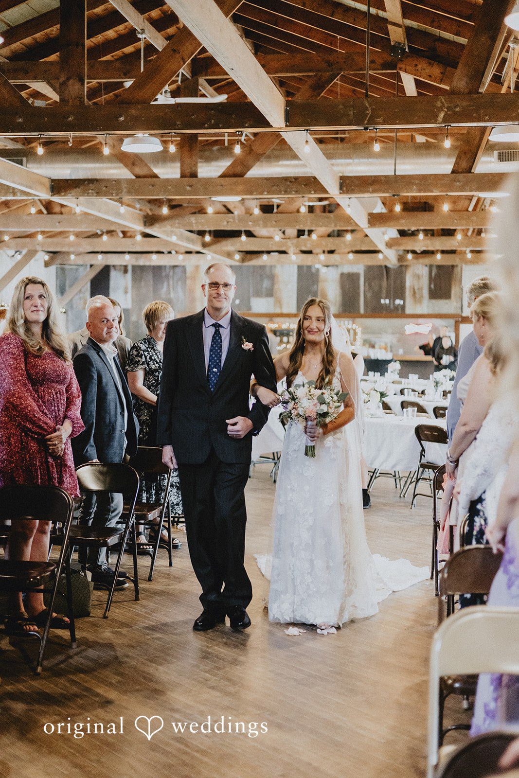 Emily + Ethan Bride walking down the aisle during the ceremony.