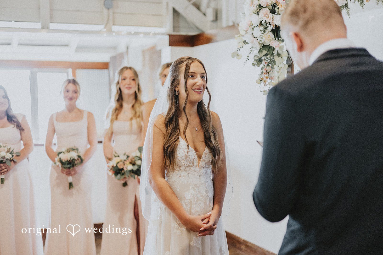Emily + Ethan Bride standing at the altar during the wedding ceremony.