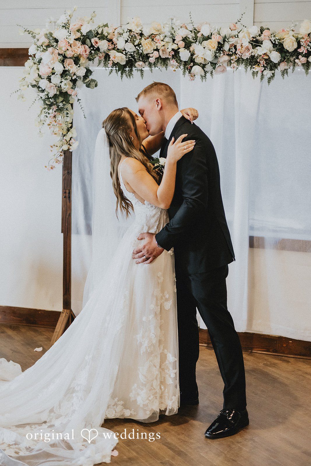 Emily + Ethan Couple kissing each other at the end of the ceremony.