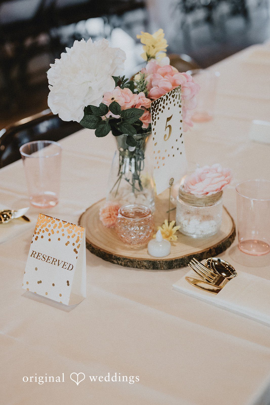 Emily + Ethan Small decorative tray with trinkets on a reception table.