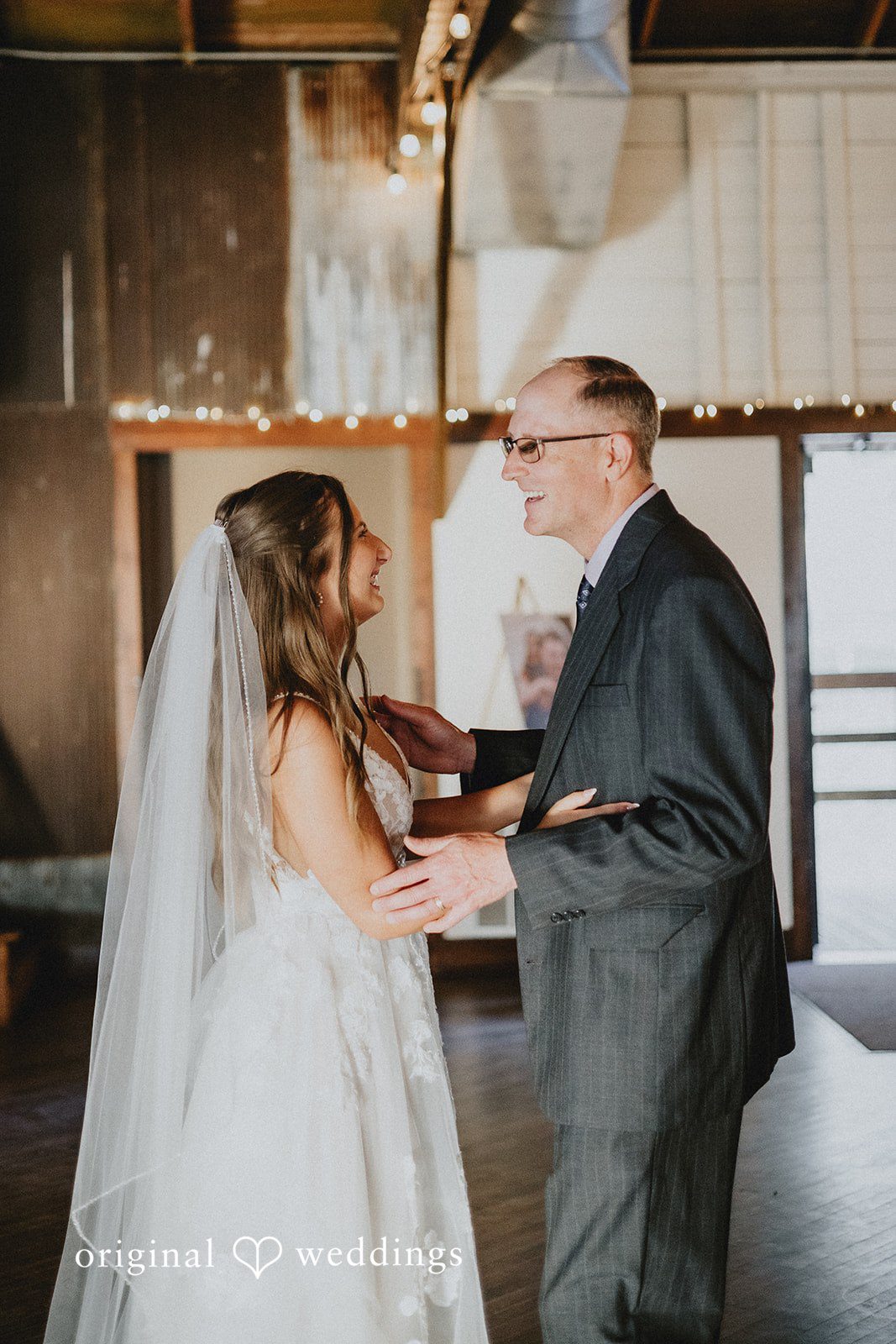 Emily + Ethan Bride dancing with a male guest at the wedding reception.
