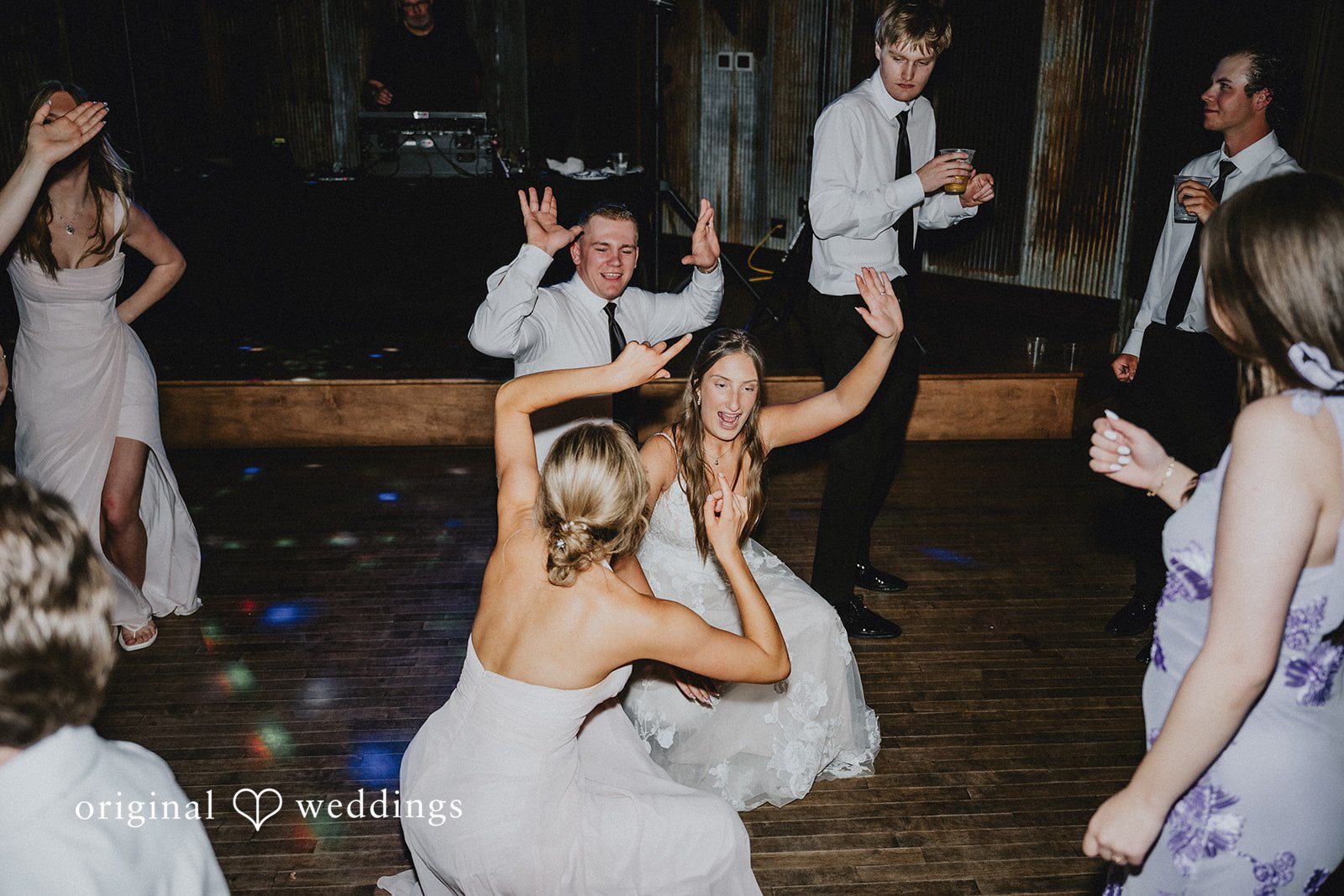 Emily + Ethan Group of guests dancing and celebrating at the wedding reception.