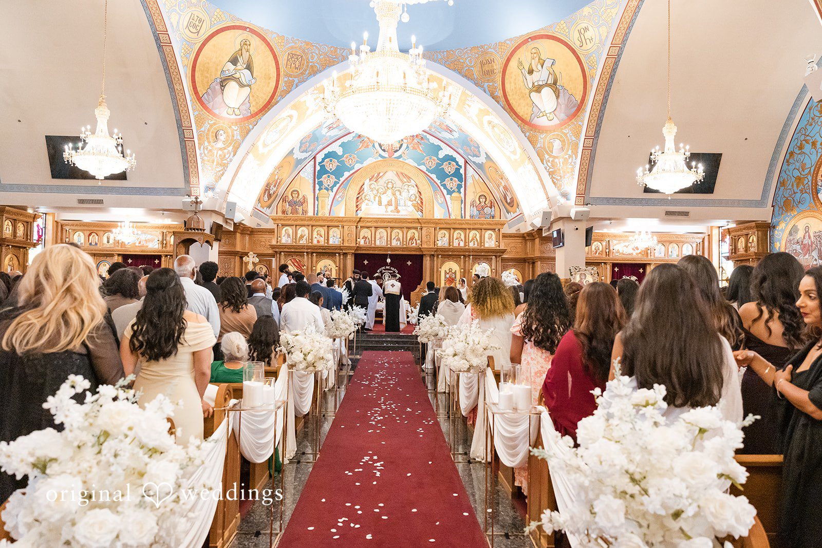 A view facing the altar during a traditional church wedding ceremony.